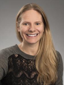 Dr Curl, a young white woman with long blond hair